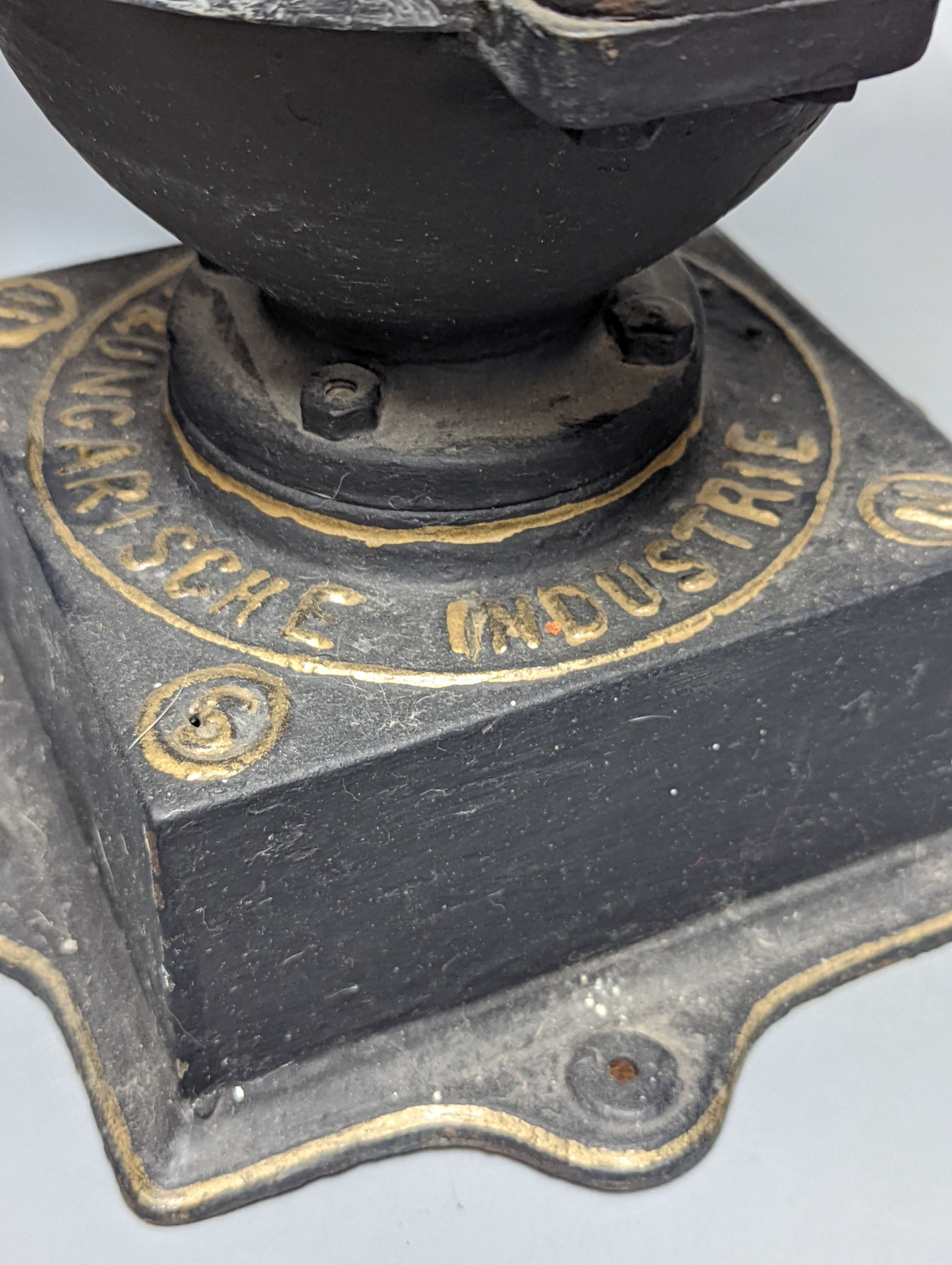 An Austrian cast iron and copper coffee grinder 45cm